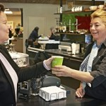 Worker serving food from a counter