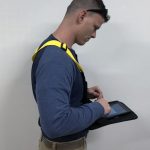 Safety vest with pull-down computer tablet surface