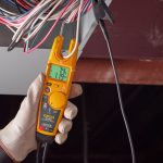 Orange handheld electrical tester