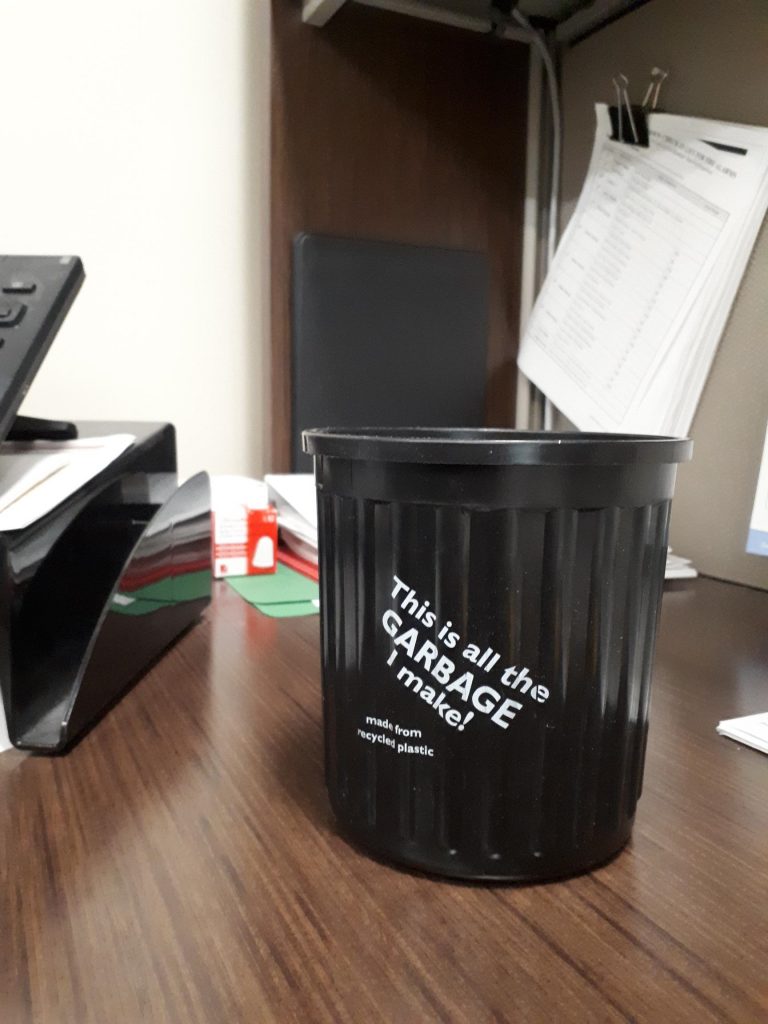 Personalized desktop trash pails encourage East Port tenants to recycle.