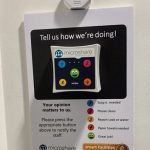 Microshare's IoT sensor and button on wall pad in restroom to alert FMs of issues