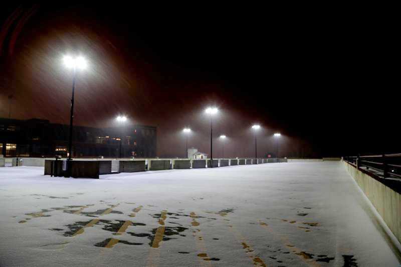 Western Specialty Contractors image of snow-covered parking garage with streetlights