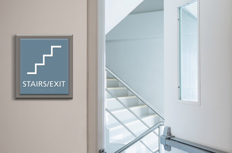 "STAIRS/EXIT" sign next to staircase in a house of worship