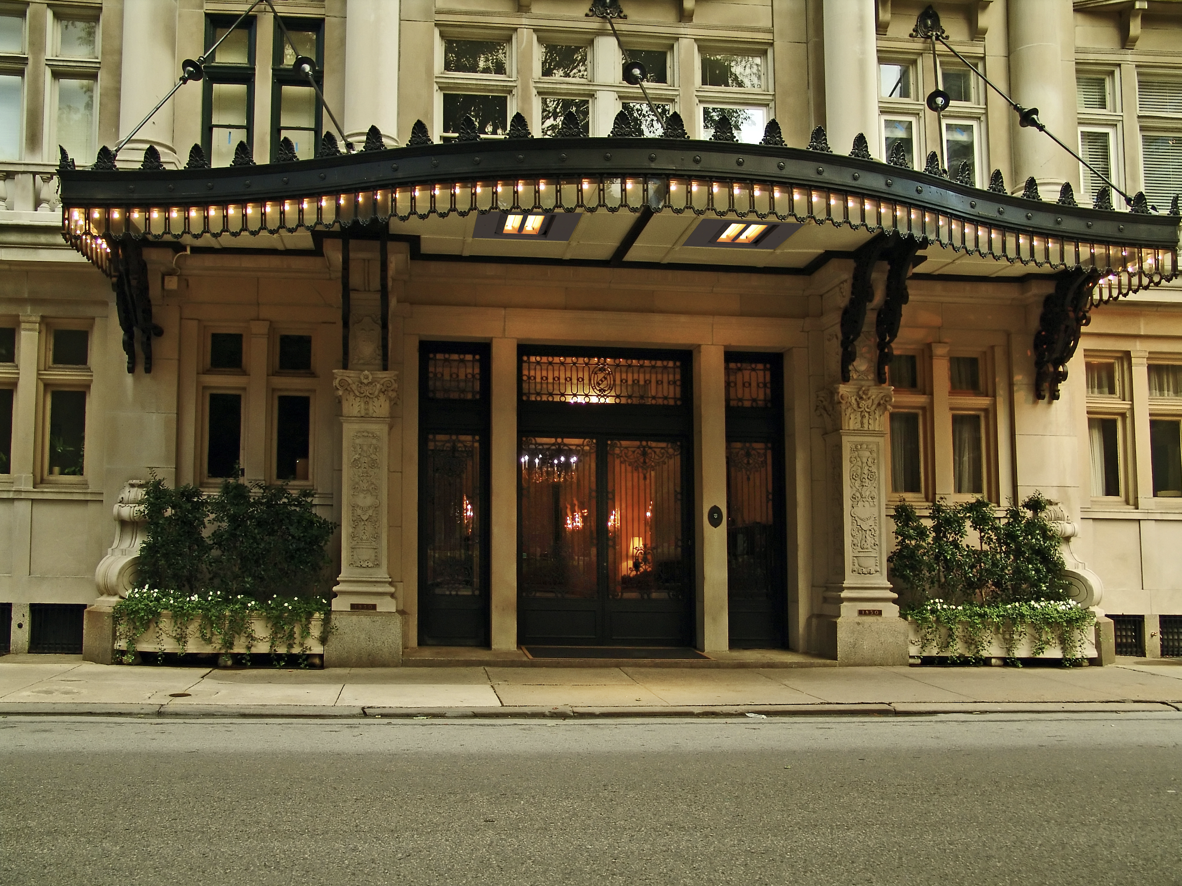 Marley’s Infrared Radiant Heaters installed at the entrance to a luxury commercial building with an overhang